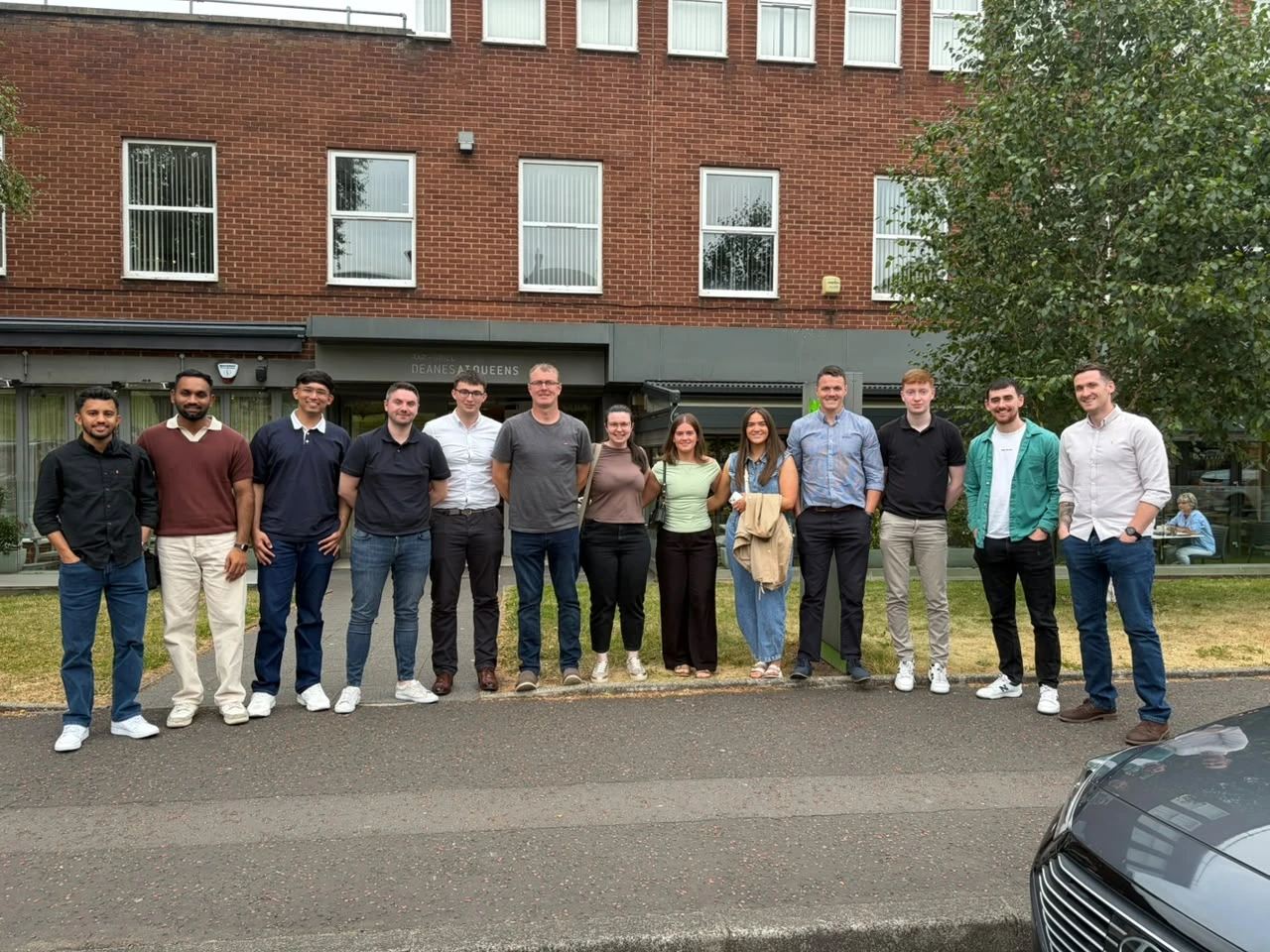 The visiting team and hosts standing together outside during the FP McCann visit.